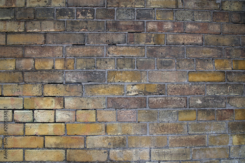 Beige Brick Wall Closeup. Aged, partially grey surface. Photographed in Sweden.