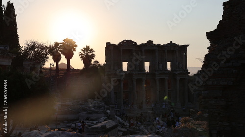 Night view of the historic Ephesus Ancient City in Turkey, showcasing illuminated Roman ruins and timeless classical architecture after sunset.