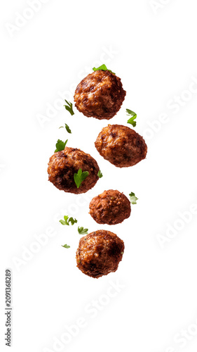 Delicious meatballs with herbs floating