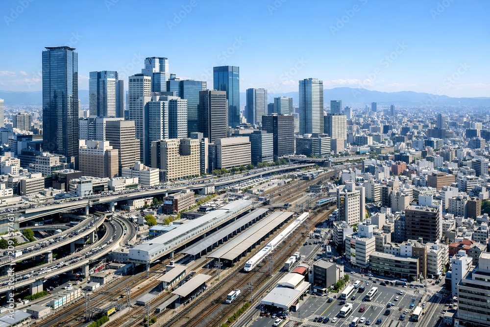 Obraz premium 大阪駅周辺の都市風景広がる高層ビル群と鉄道ジャンクション