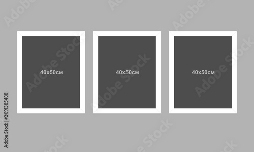 A vector set of white picture frames on a gray wall. A modern concept featuring empty picture frames. A mockup of picture frames.