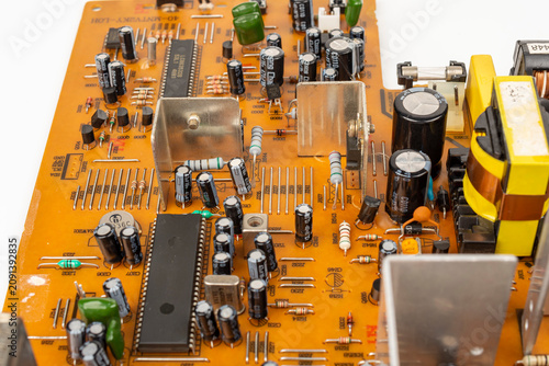Brown printed circuit board components and parts. A circuit board with radio components from an electronic device.