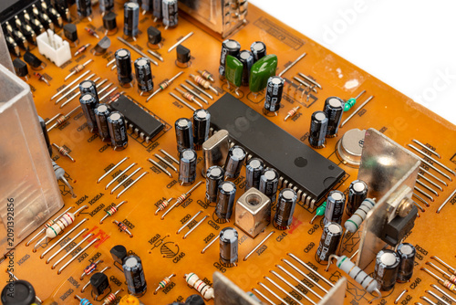 Brown printed circuit board components and parts. A circuit board with radio components from an electronic device.