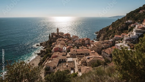 Coastal View of a Small Village by the Sea During Bright Daylight With Sunlig...