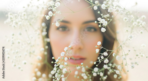 Woman with White Flower Crown in Soft Light