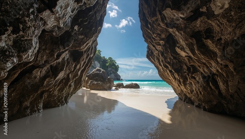 Blue Sea Seen Through Cave Rocks on a Sunny Day at the Beach in a Tropical Lo...