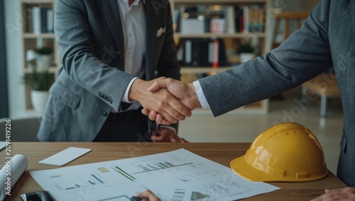 Business Partners Shake Hands to Finalize a Deal in an Office With Constructi...