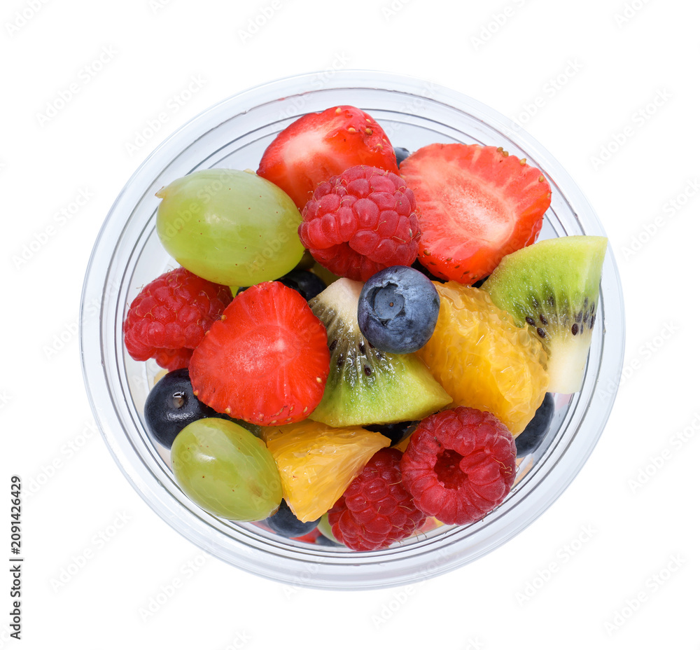 Obraz premium Tasty fruits in plastic cup isolated on white, top view. To go snack