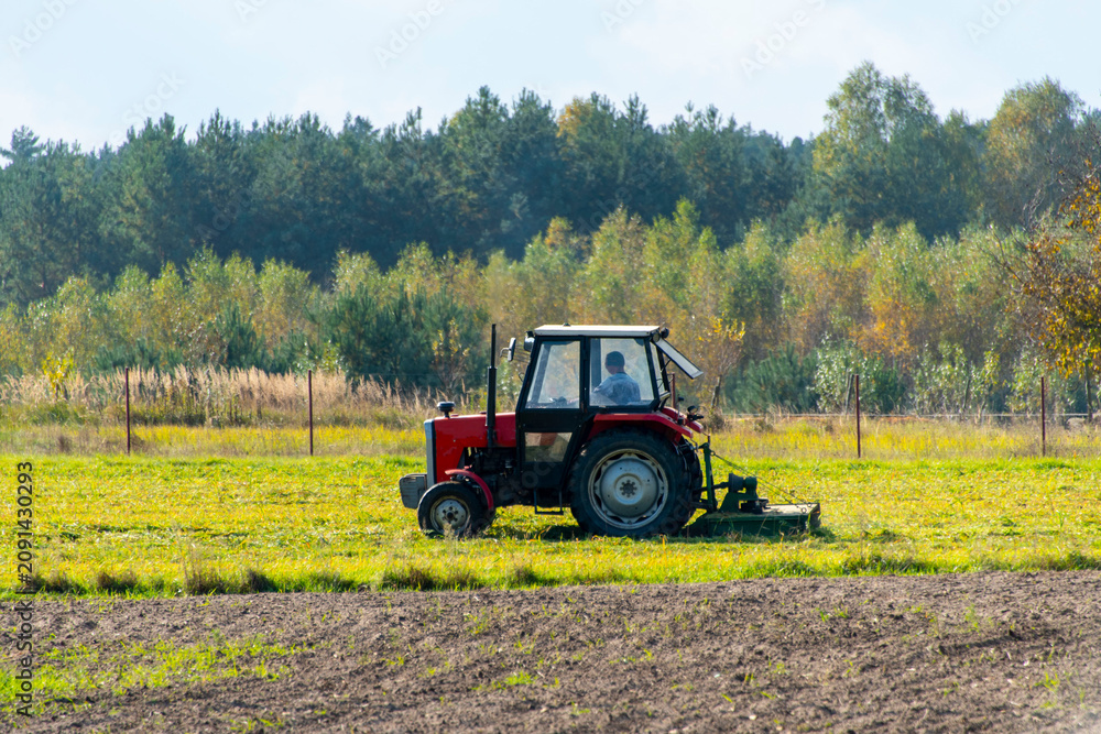 Fototapeta premium Tractor with a Mounted Mower