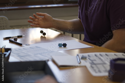 Принти на полотні Stock photo showing a player making roll with a pair od role-playing polyhedral dice