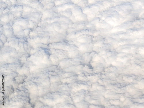 Photography Soft white cloud layer seen from above, full frame aerial texture with creamy bi