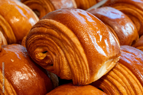 French pastry roll pain au chocolat for traditional breakfast, fresh baked in artinasal bakery in Paris, France