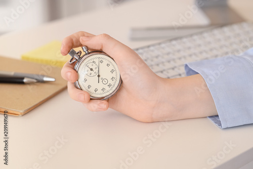Person holding a stopwatch ...