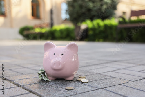 Pink piggy bank with money ...