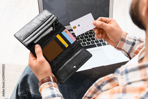 Man with wallet and credit ...