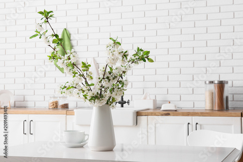 Vase with white blooming br...