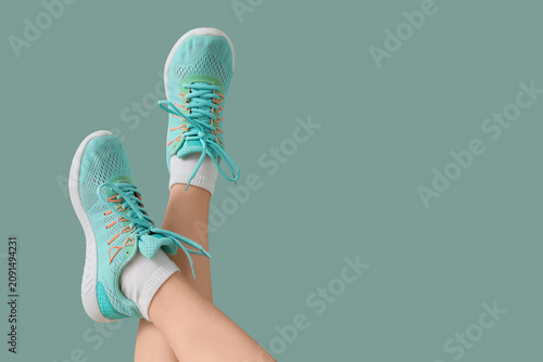 Female legs in sneakers on ...