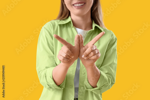 Young woman using sign lang...