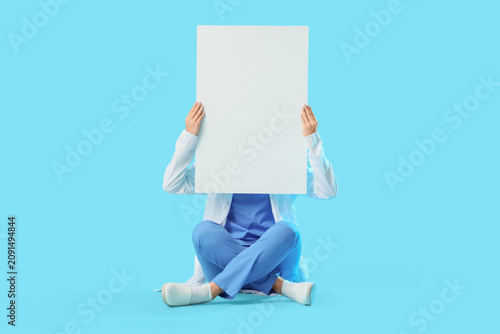 Young female doctor holding...