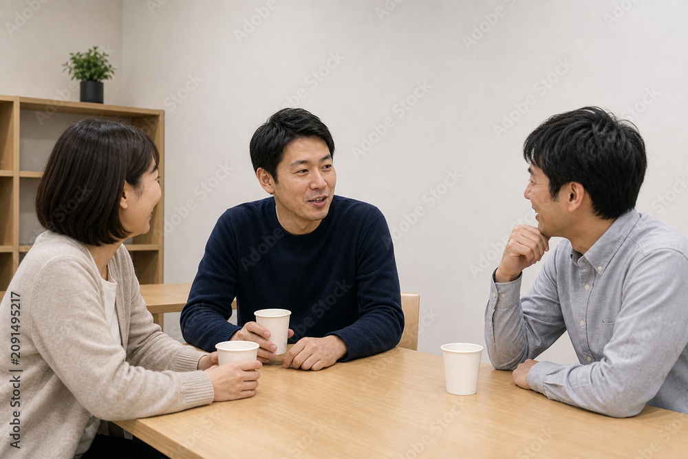 Fototapeta premium 休憩室で試合の話をする三人