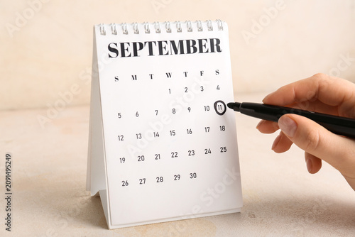 Female hand marking dates i...