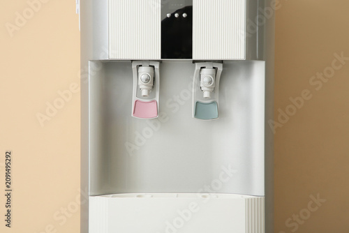 Modern water cooler near be...