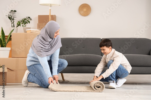 Happy Muslim mother with he...