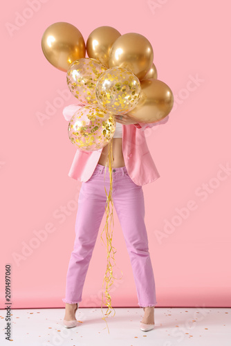 Young woman with air balloo...
