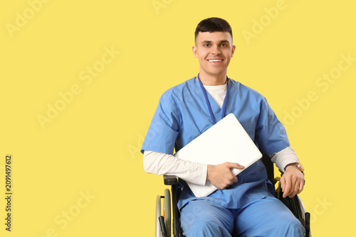 Young male doctor in wheelc...