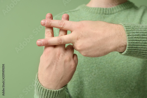Man making hashtag sign wit...