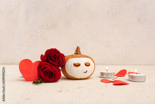 Pumpkin with drawn face, ro...