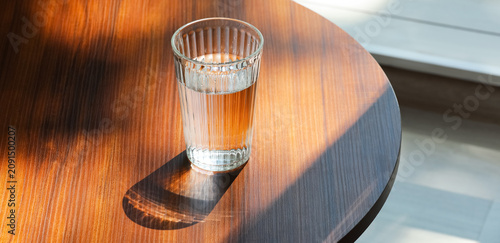 Glass of water on a wooden ...