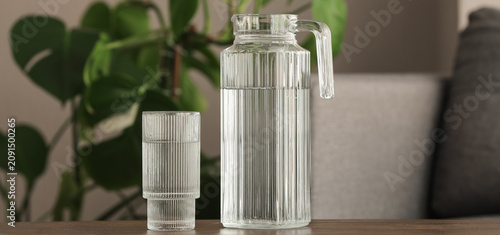 Glass pitcher and drinking ...