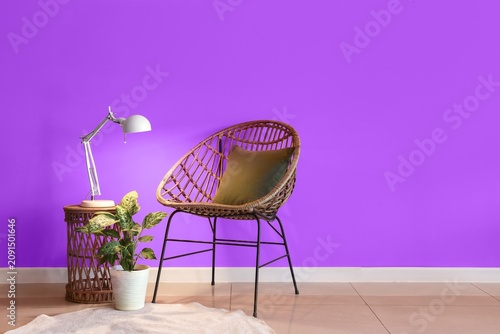 Wicker chair with olive pil...