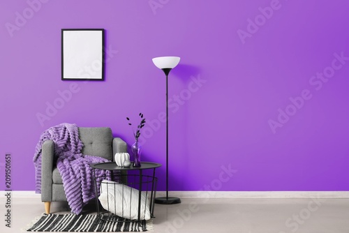 Cozy gray armchair with a s...