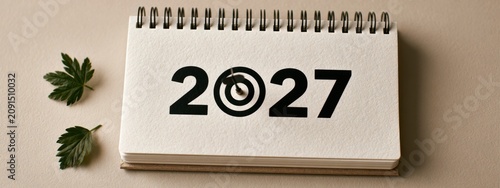 Calendar page shows the year 2027 with a target symbol, highlighting goals and plans for the future
