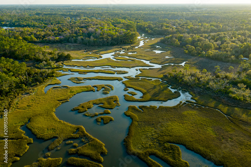 Aerial Drone View of Winding Tidal Creeks Through Coastal Salt Marsh