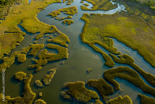 Aerial Drone View of Winding Tidal Creeks Through Coastal Salt Marsh
