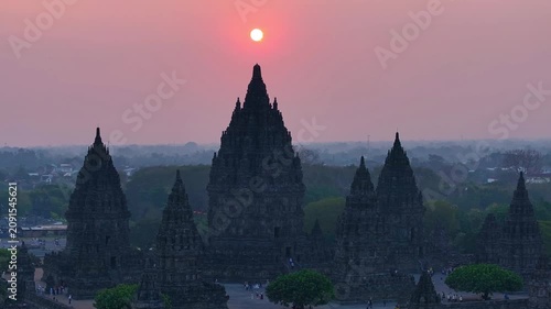 Cinematic drone footage of Prambanan Temple at sunset, revealing the majestic ancient architecture and stunning golden-hour atmosphere of Indonesia’s cultural heritage landmark.