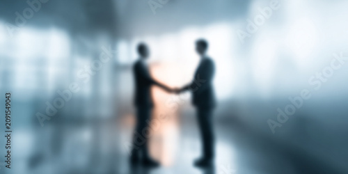 Blurred image of businesspeople shaking hands. Professional Business Agreement Concept
