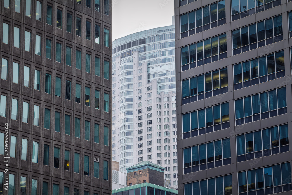 Fototapeta premium Business skyscrapers and high rise office towers in downtown Toronto, Canada, dense corporate architecture, glass facades and the vertical skyline of the city's central business district in america.