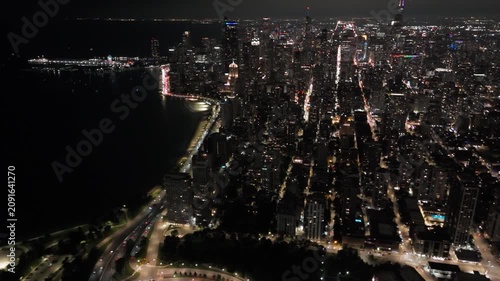 High Aerial Drone Tilt Shot Of Downtown Chicago At Night
