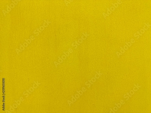 Wall painted in bright and warm yellow for background and decorations