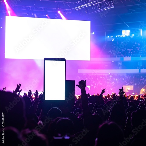 Concert Crowd Enjoying Live Performance with Stage Lights and Large Screen