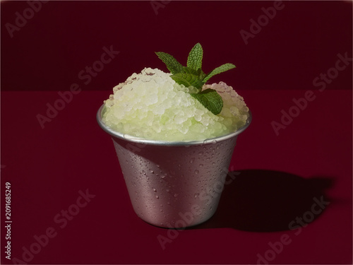Mint Julep in Copper Cup on Maroon Background