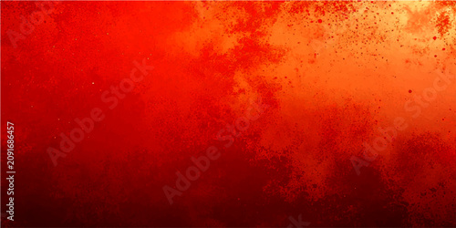 Fotografía Abstract fiery red and orange textured background with soft glowing particles and atmospheric effect
