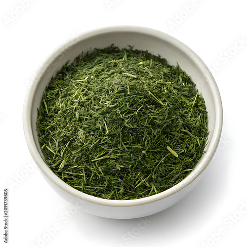 Dried dill weed in a bowl isolated 