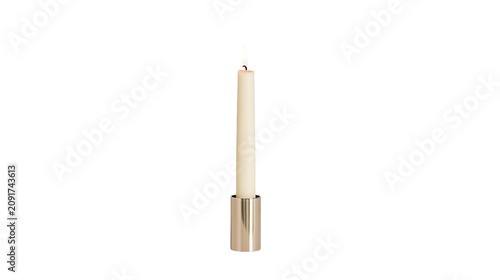 Billede på lærred Cream colored taper candle with burning flame in a silver holder, isolated on tr
