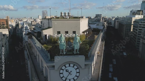 View of the rooftop of a building in Buenos Aires with clock and sculptures