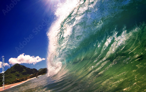 Majestic Turquoise Wave Curling Perfectly Against Blue Sky